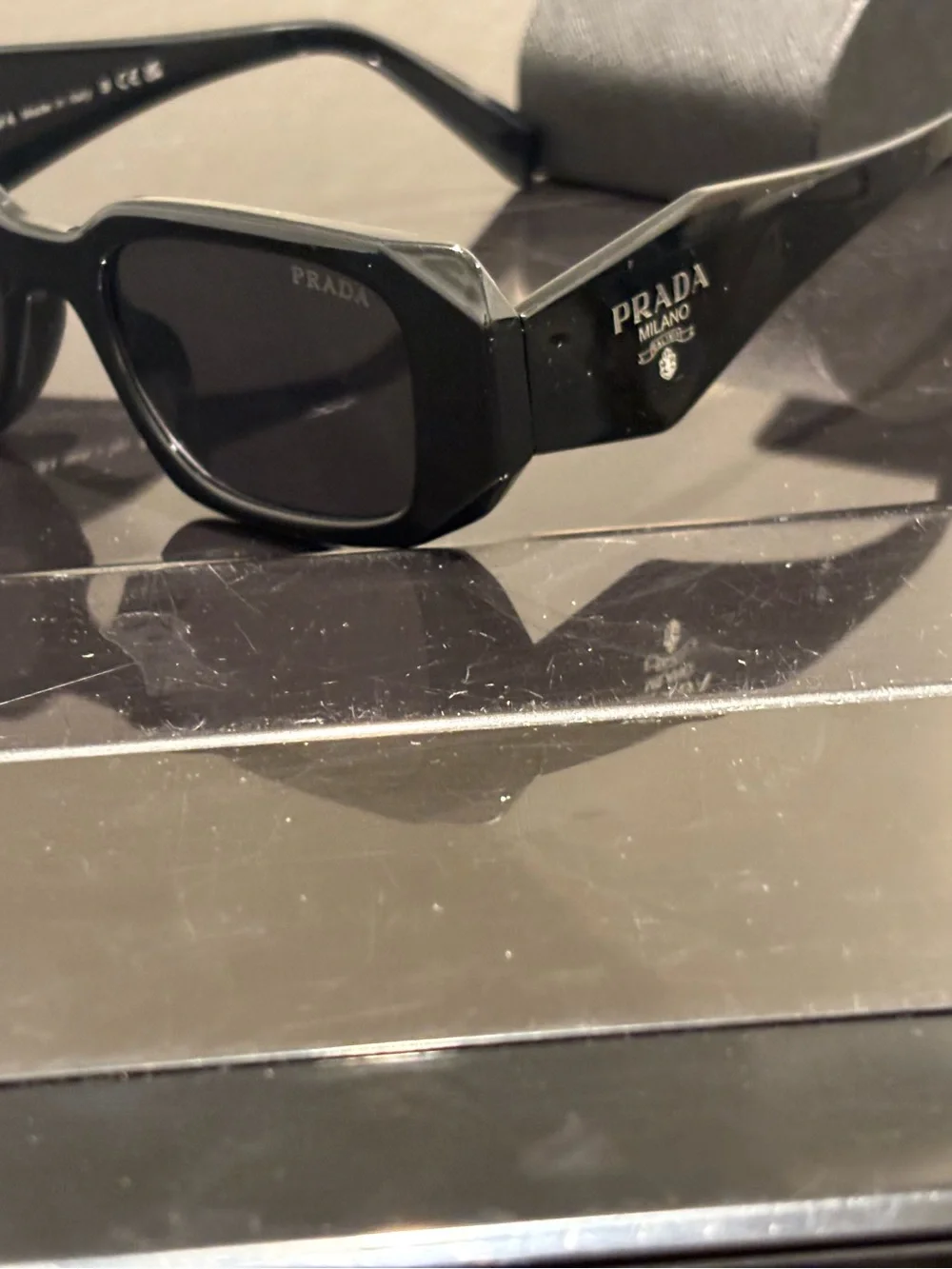 Prada Black Sunglasses with Textured Gray Case